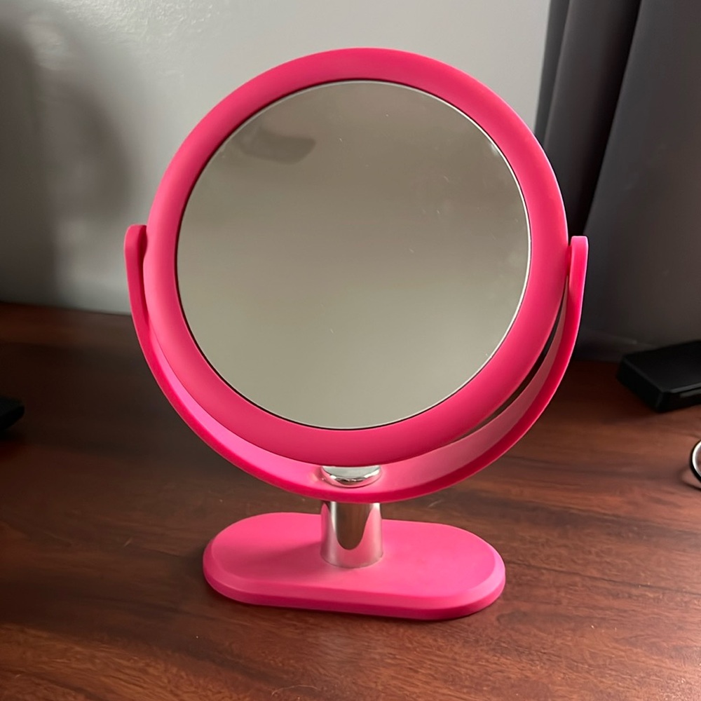 Double sided pink mirror.